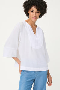 Blouse tunique en tissu gaufré brodé