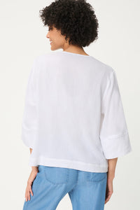 Blouse tunique en tissu gaufré brodé