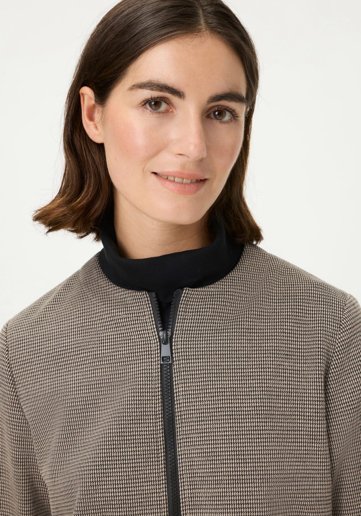 Veste à carreaux zippée